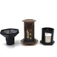 AeroPress coffee maker with funnel and microfilter papers in black holder